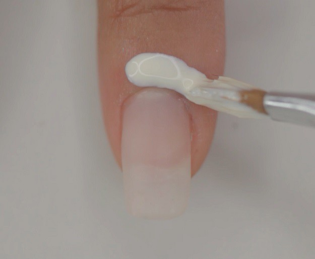 Step 1: Put peel−off base coat | Super Easy Geometrical Negative Space Nails You Can Wear on Your Date
