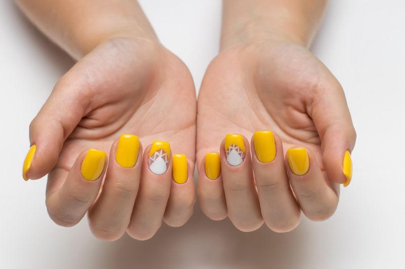 nail art on yellow nail polish