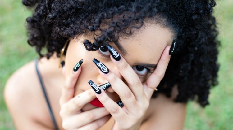 woman covering her face | Coffin Nails | Nail Designs For The Hottest Trend In 2020 | coffin nails | long coffin nails | Featured