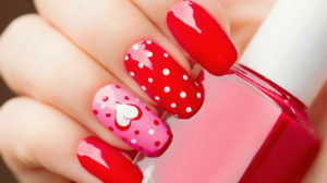 Valentines Day Holiday style bright Manicure with painted hearts and polka dots | Cute Red And White Nail Art Designs To Try This Year | red and white nail designs | Featured