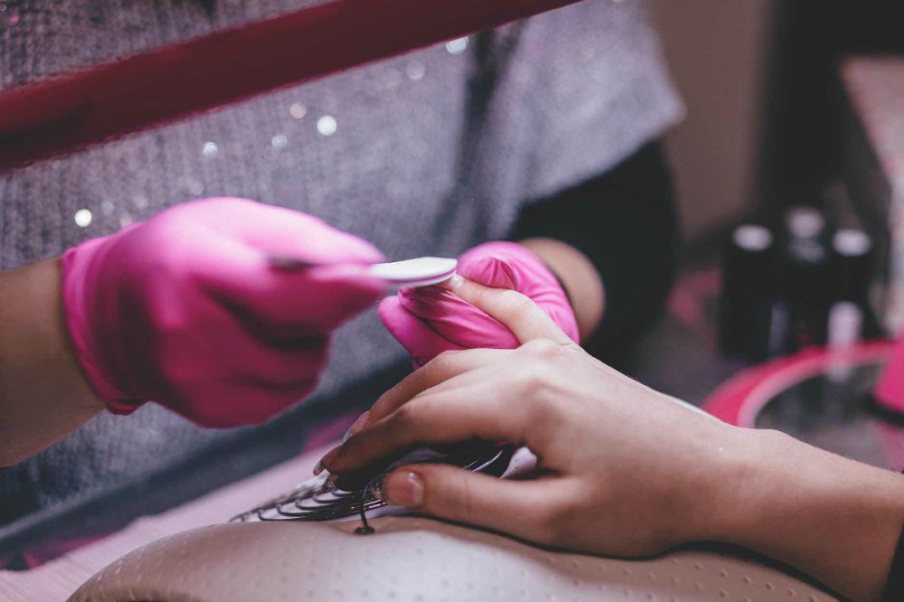 Woman nail cleaning close up at nail salon | Shellac Nail Designs | Everything You Need To Know