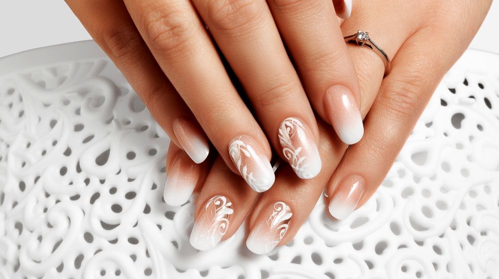 manicure white abstract pattern on womens nails | Gorgeous White Nail Designs For Every Occasion