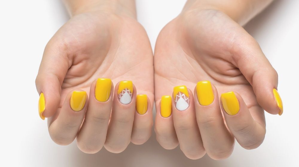 yellow nails white triangles on square short nails | Sophisticated Nail Art Designs For Every Working Mom