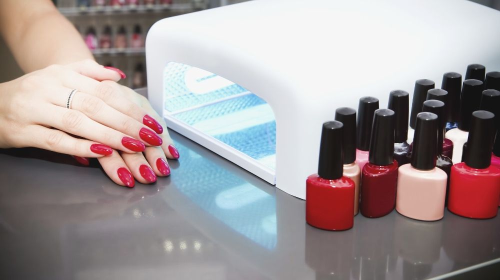 manicure set beauty salon beautiful female hands | UV Nail Lamp vs LED Nail Dryer | Which One Should You Get?