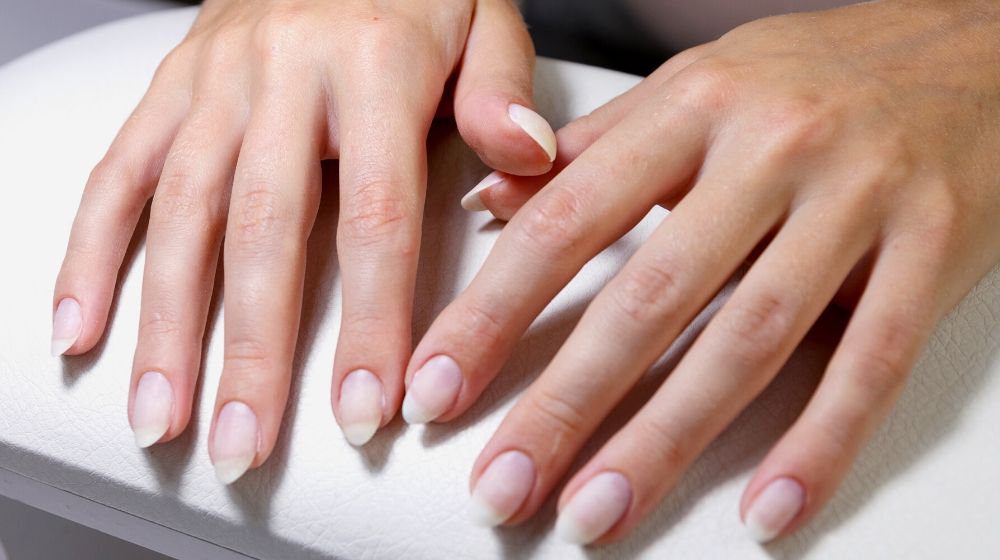 hands client manicure before applying gel | Facts About Dip Powder Nails You Need Know
