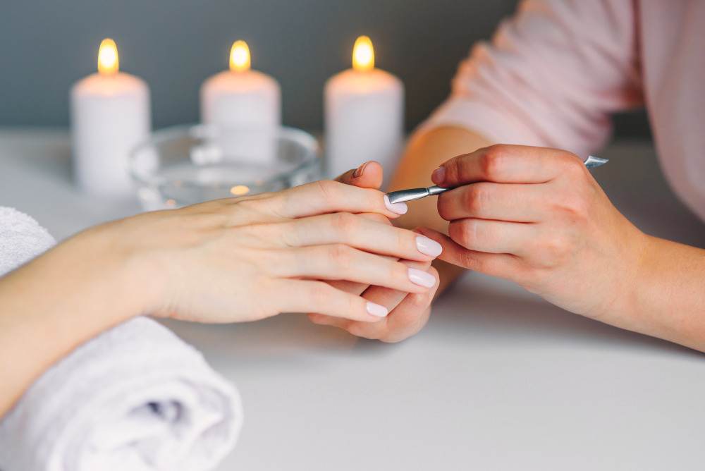 Closeup of beautiful woman hands getting manicure in spa salon | NexGen Nails | What Is This Latest Nail Trend? | what is nexgen nails