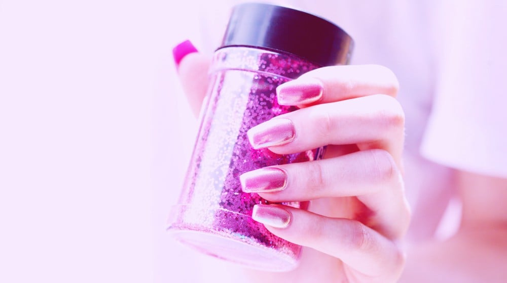 Person holding pink container | Thoughtful Father’s Day Nails To Express Love To Your Dad | nail art | Featured