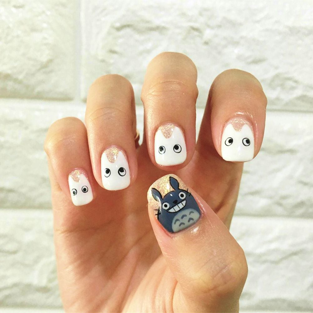 Person's left hand showing white nail polish stickers | How To Apply Nail Stickers | Step By Step Guide