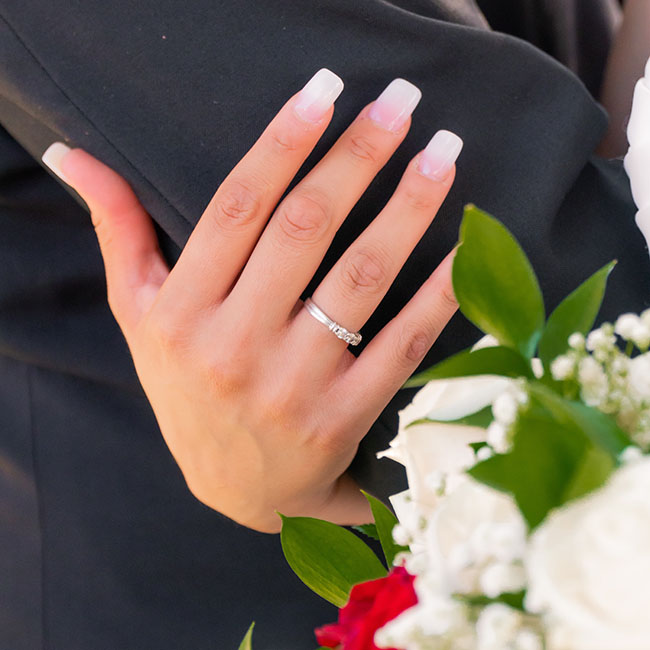 person wearing silver ring | Lizzo's Trendy Milky White Nails We Absolutely Love