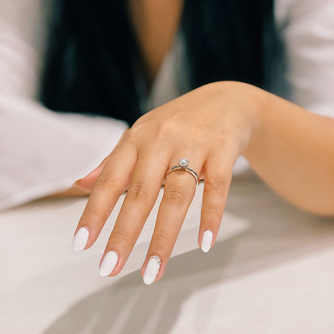 person with white nail polish on left fingers | Lizzo's Trendy Milky White Nails We Absolutely Love