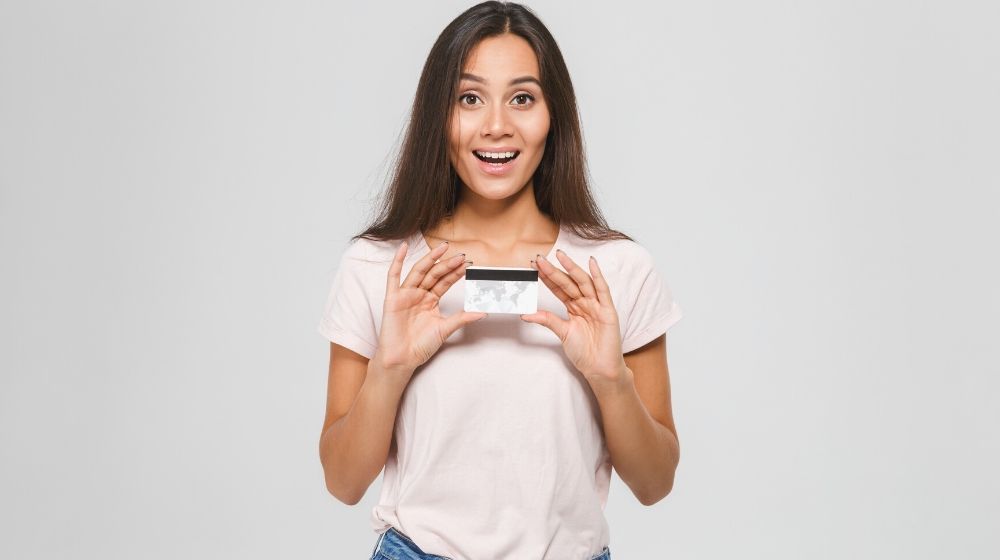 portrait excited happy asian woman holding credit card | Long Fingernails Hacks For People Having A Hard Time Doing Chores