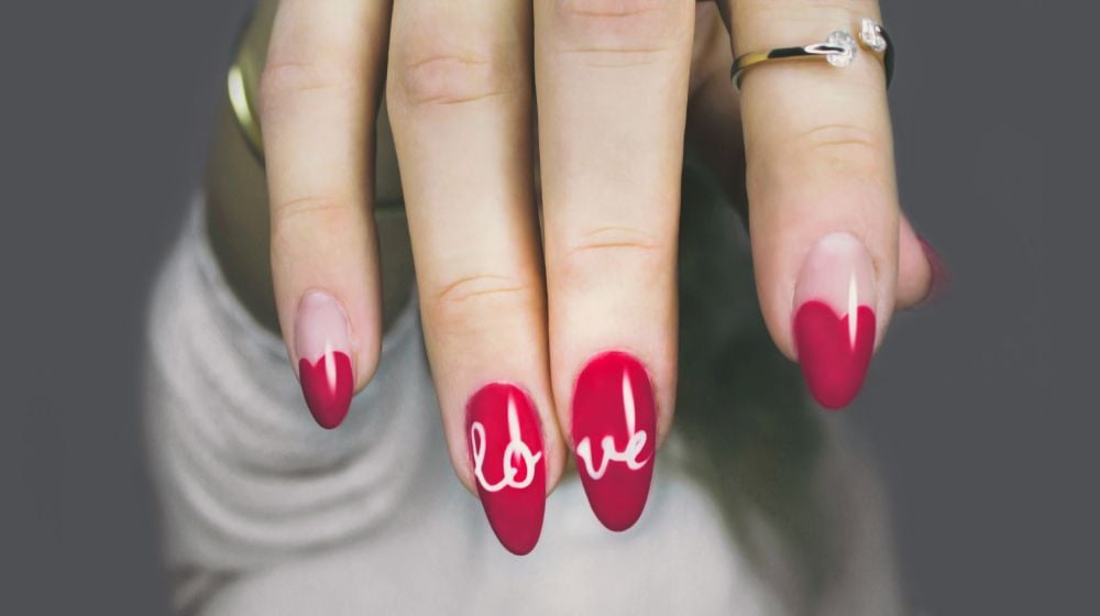 Selective focus photography of woman's pink manicure | How To Apply Nail Stickers | Step By Step Guide | Featured