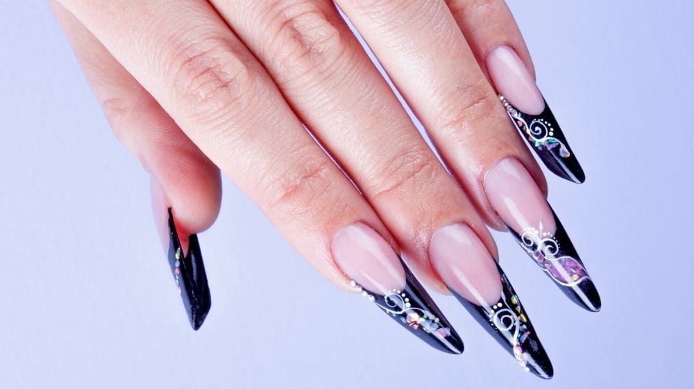 woman hand dark extreme nails | Dainty Black Nail Designs You Should Try